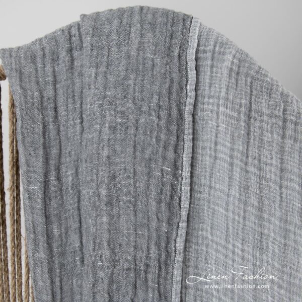 Linen grey doublesided blanket, one side light, other - dark.