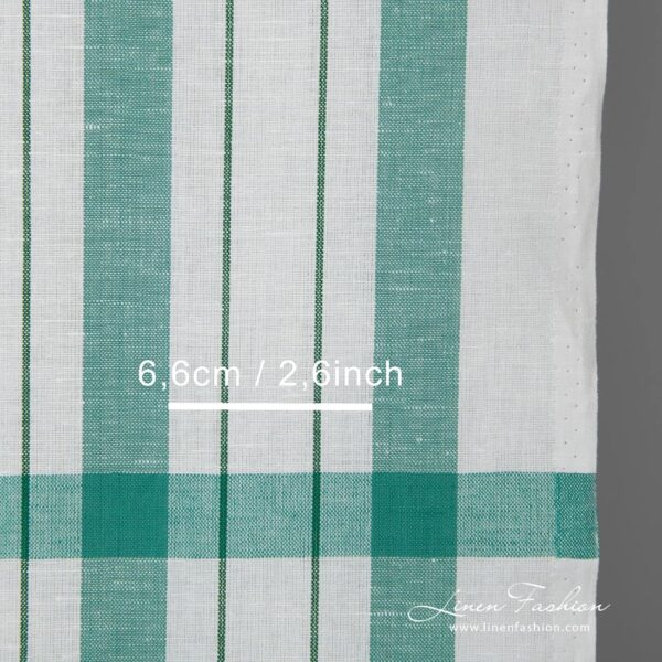 White linen cotton fabric with green stripes detail close view