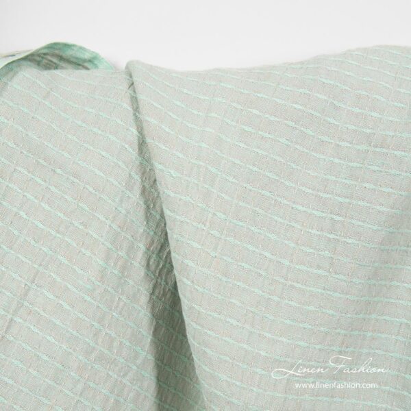 Greenish patterned linen fabric, washed
