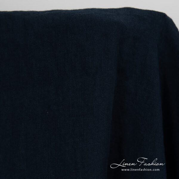 Washed linen fabric in blue black colour.