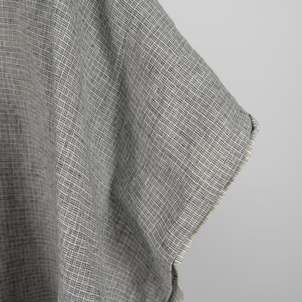 Linen fabric washed dark grey colour close up edge view