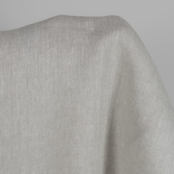 Beige linen fabric in a diamond pattern close up detail