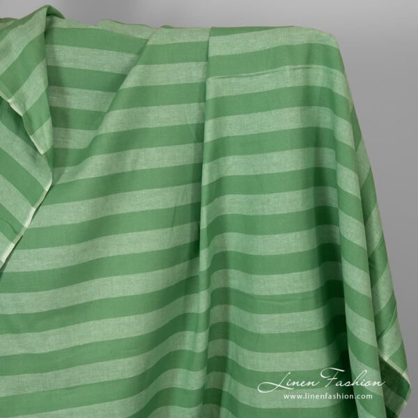 Green linen fabric with wide stripes.