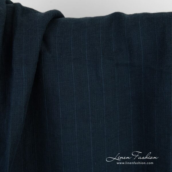 Dark blue linen fabric in stripes, specially washed to increase softness