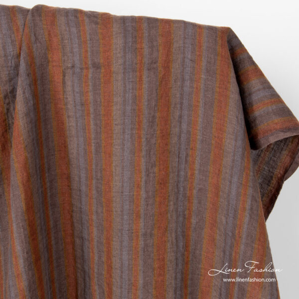 Linen fabric in brown grey vertical stripes, washed