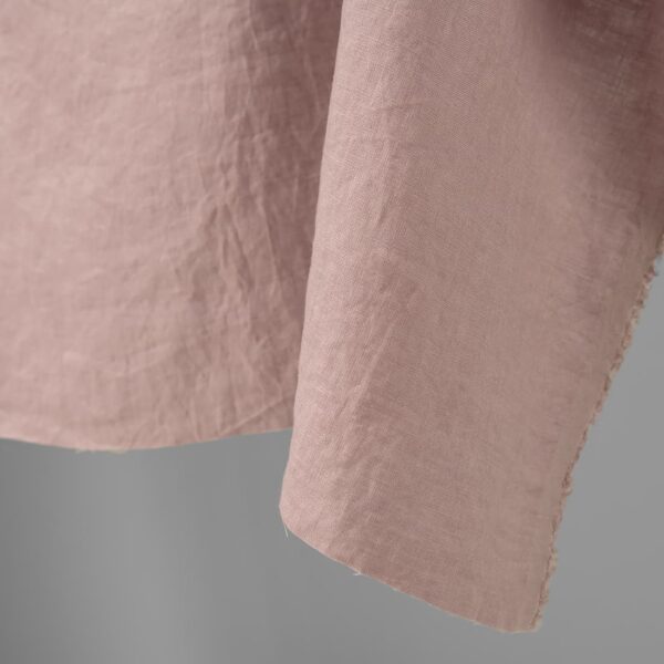 Washed linen fabric light lilac colour edge view