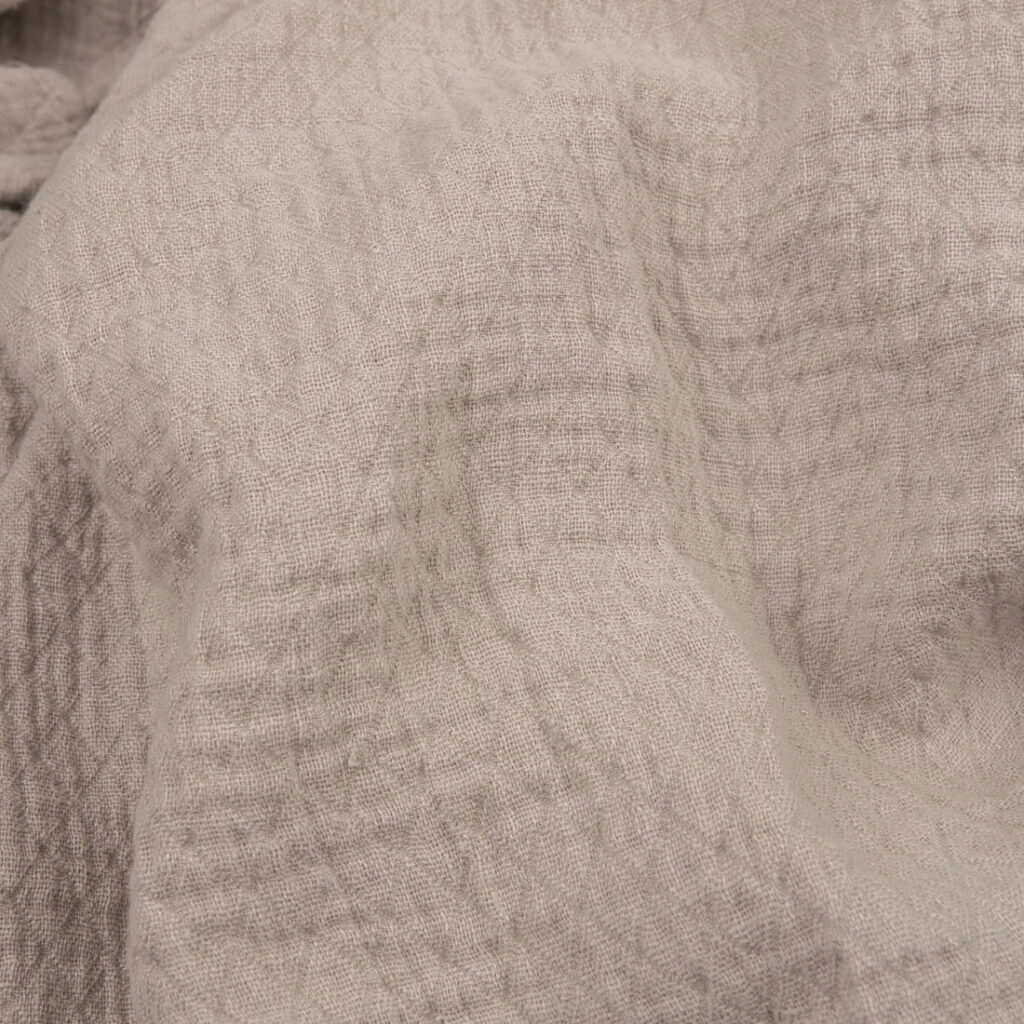 Light grey linen fabric with a diamond pattern washed