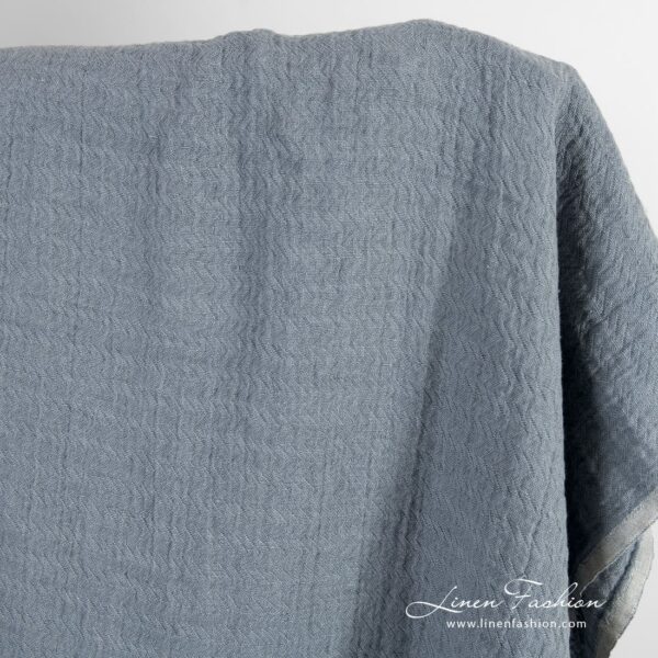 Bluish grey jacquard linen fabric in zigzag pattern, washed