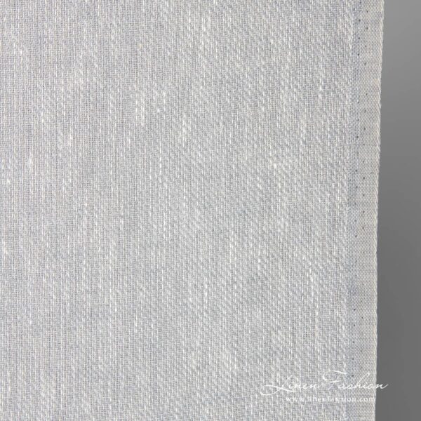 Narrow linen fabric in white-grey melange close up photo
