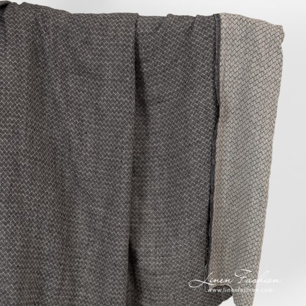 Washed linen fabric in small black grey diamond pattern.