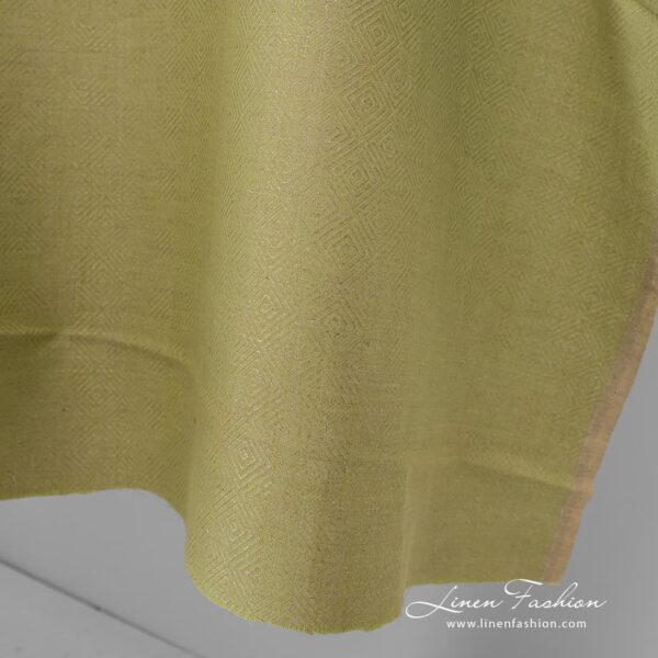 Diamond patterned green grey fabric.
