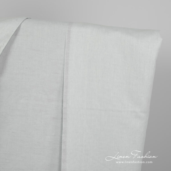 Linen cotton fabric blueish green twill weave edge view