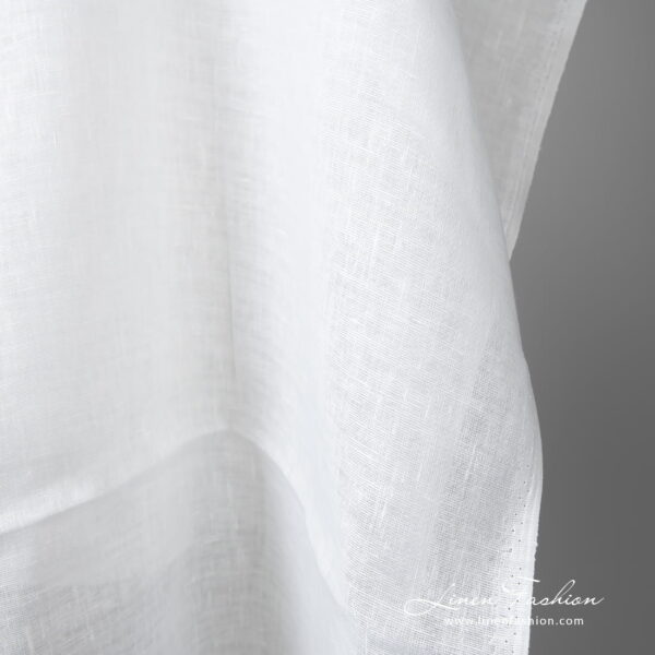 Lightweight linen fabric bright white colour edge view