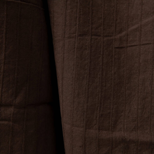 Dark brown washed linen cotton fabric close up detail