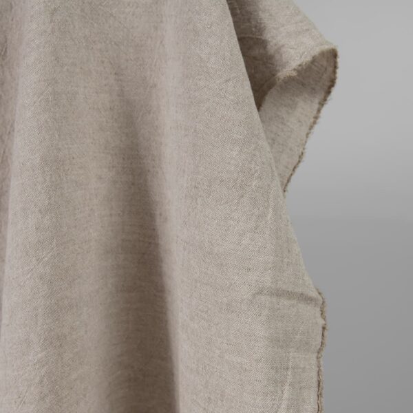 Wide washed linen cotton fabric sand colour edge view