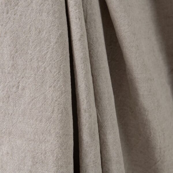 Wide washed linen cotton fabric sand colour close up detail