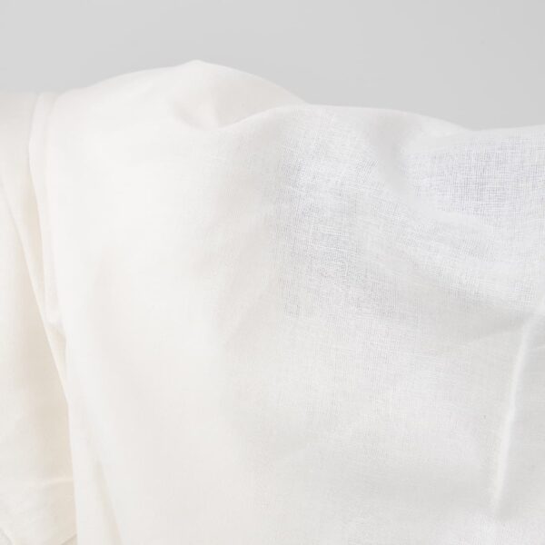 Wide linen cotton fabric white colour close up photo