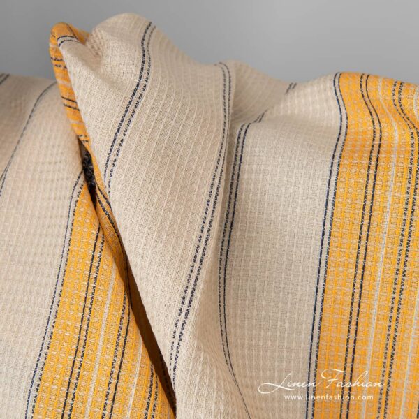 Linen cotton fabric sand waffle with yellow blue stripes close up detail