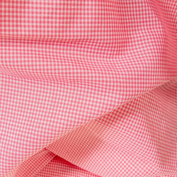 Linen cotton fabric in bright pink checks close up detail