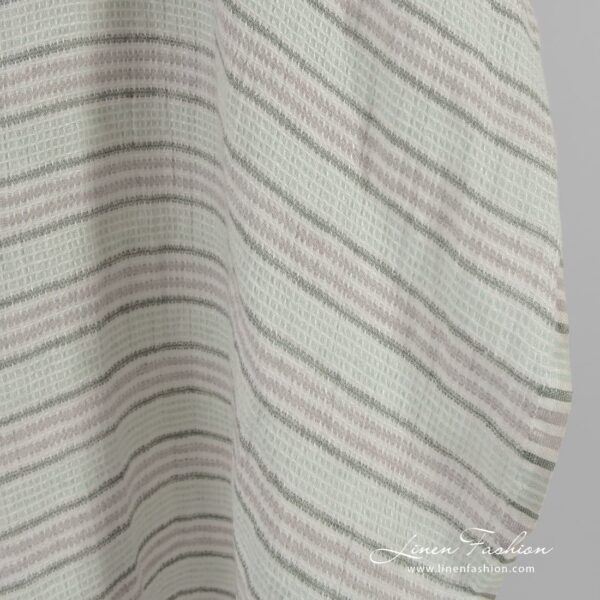 Green striped linen fabric in waffle pattern, specially washed to increase softness