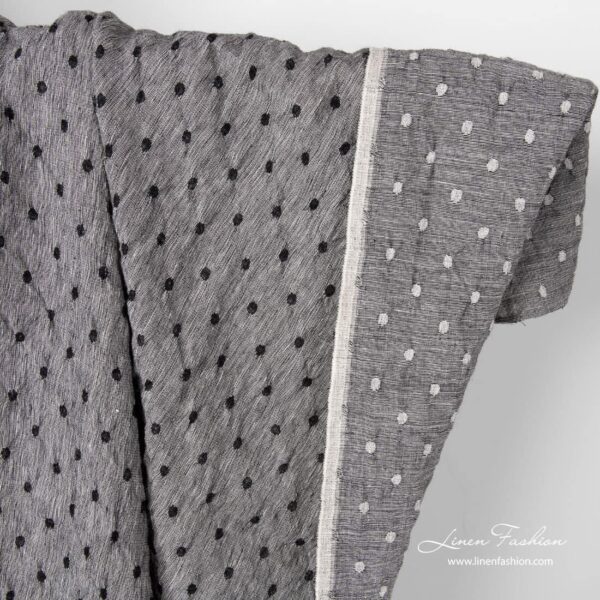 Black white linen wool fabric with dots.