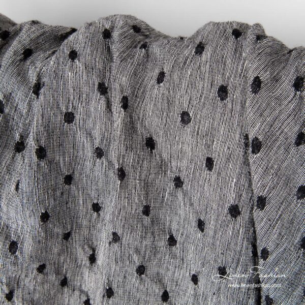 Washed black white linen wool fabric.