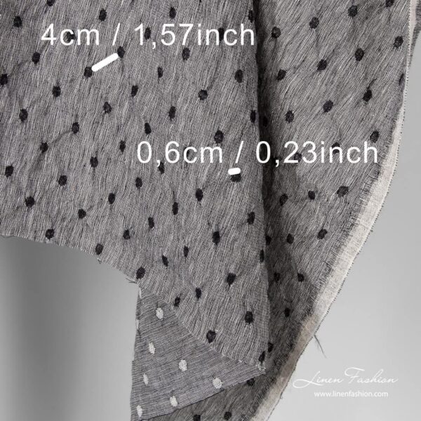 Washed black white fabric with dots.
