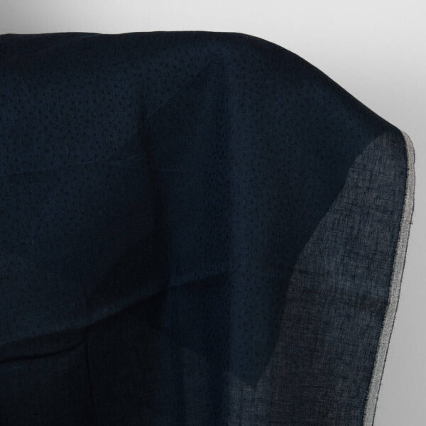 Tessuto in lana di lino nero con puntini blu scuro