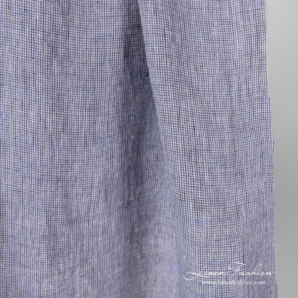 Washed 100% linen fabric in black violet checks.
