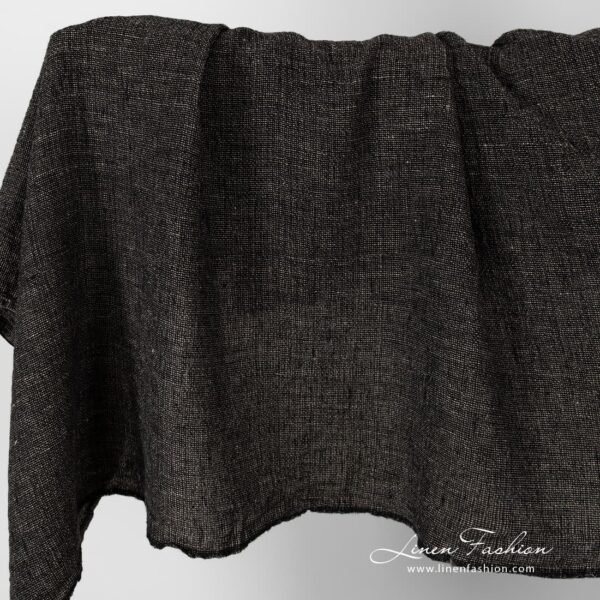 Linen fabric in black and flax melange, washed.