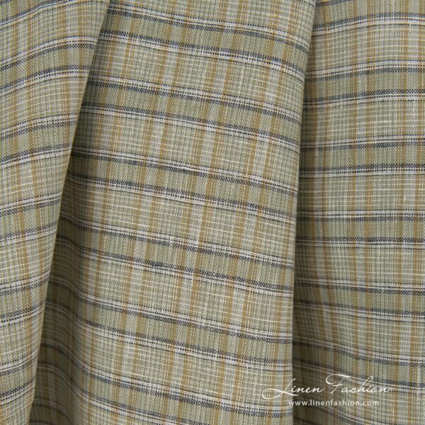 Green dyed 100% linen fabric in checks.