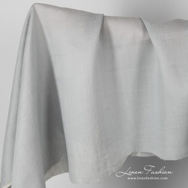 Patterned grey linen fabric.