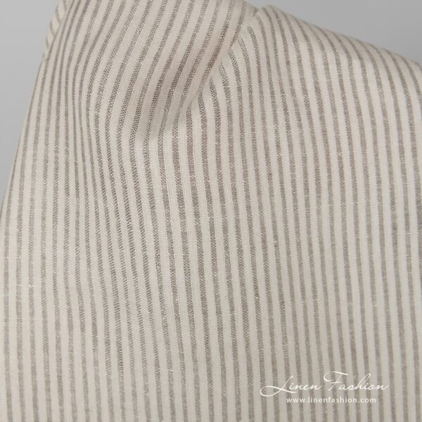 Beige 100% linen fabric in stripes.