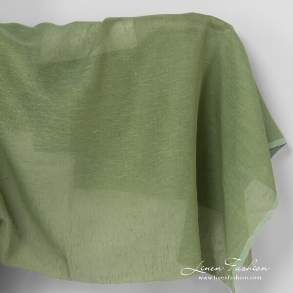 Linen fabric in apple green colour.