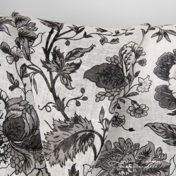 100% linen fabric decorated with black flowers.