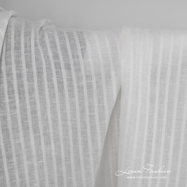 Linen fabric in off white with open weave stripes.