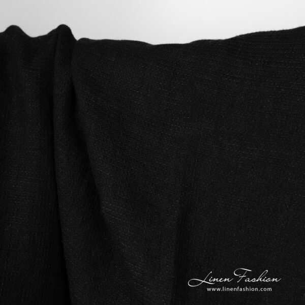Washed linen fabric solid black waffle close up detail