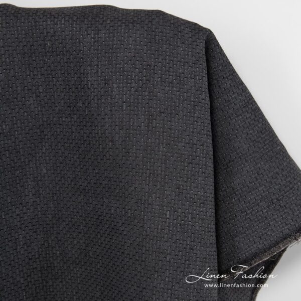 Patterned black linen fabric.