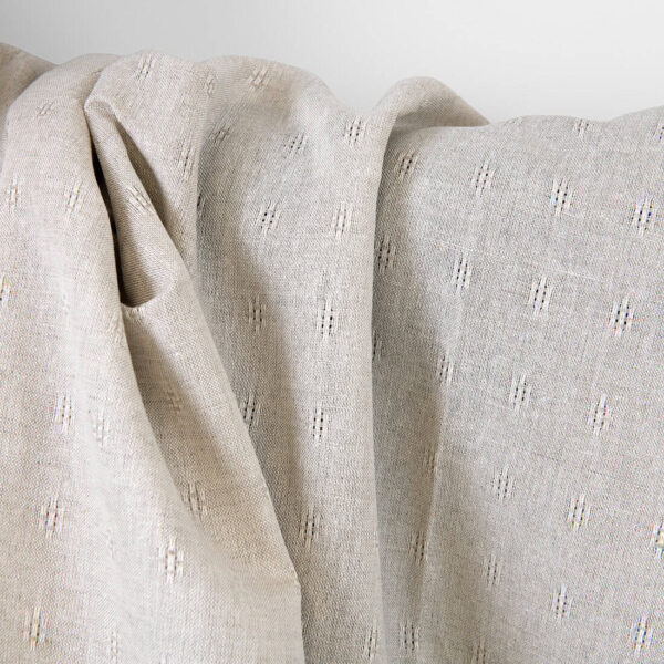 Tessuto in lino e cotone beige con motivo traforato - immagine 2